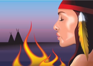 A woman in native american dress with fire.